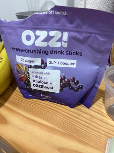 Customer's Grape bag of Ozzi crave-crushing drink sticks on the kitchen counter.